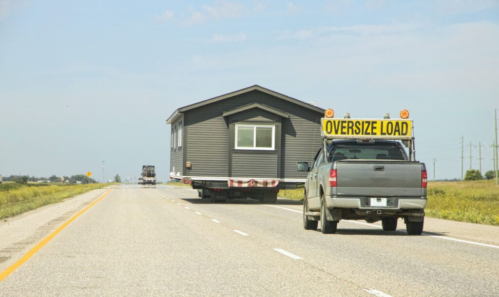 Manufactured mobile home being towed